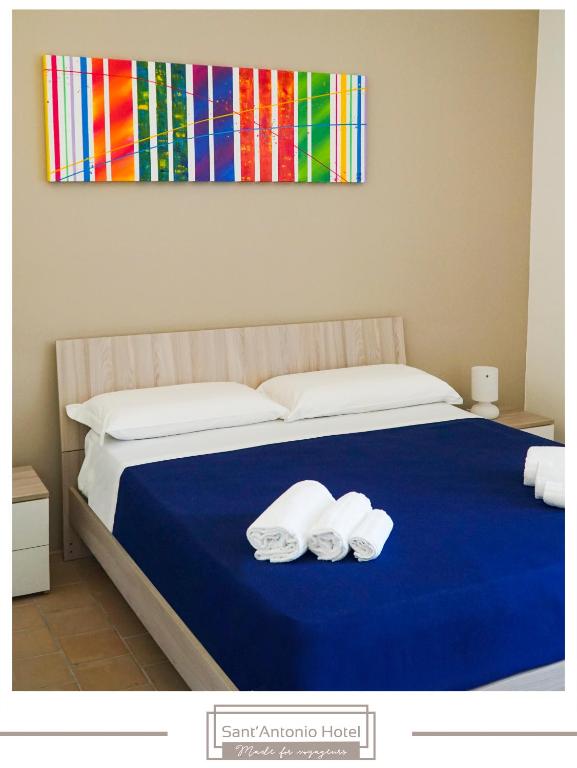Postel nebo postele na pokoji v ubytování Sant'Antonio Hotel - Dimora Storica