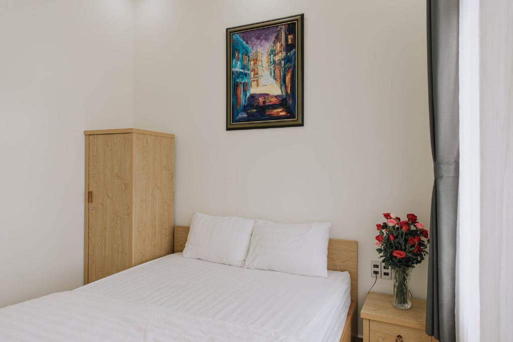 Giường trong phòng chung tại Mai DiaMond Hotel