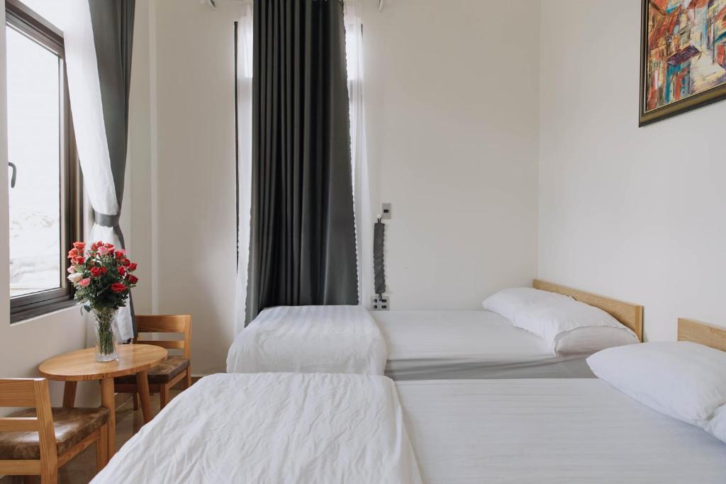 Giường trong phòng chung tại Mai DiaMond Hotel
