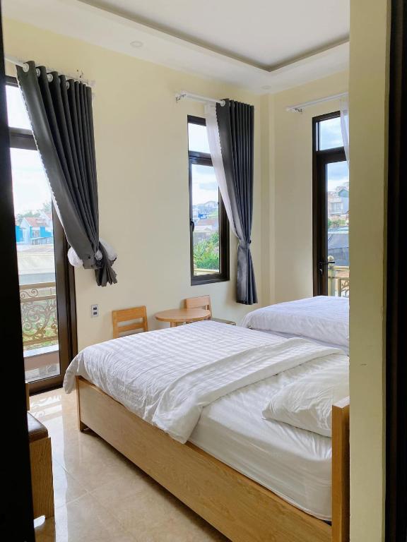 Giường trong phòng chung tại Mai DiaMond Hotel