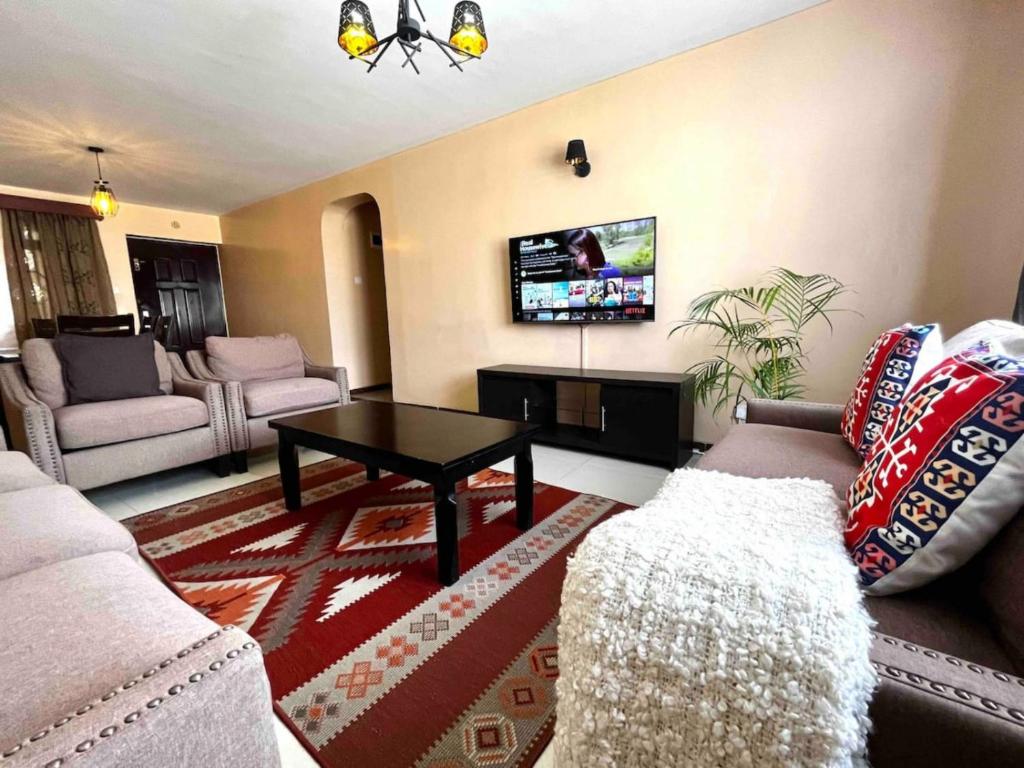 TV a/nebo společenská místnost v ubytování Milimani Suites With Pool, GYM, Secure Parking