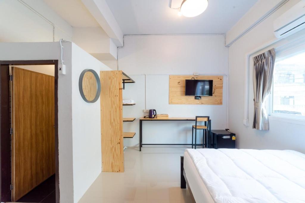 Televízia a/alebo spoločenská miestnosť v ubytovaní Joox A - Serviced Apartment
