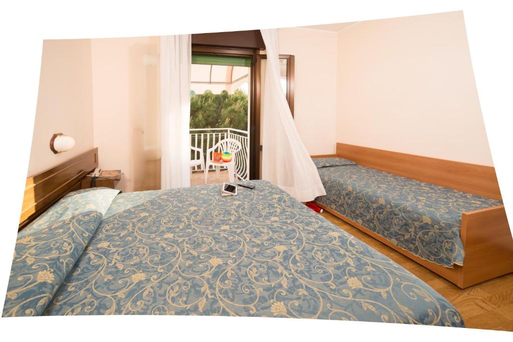 Postel nebo postele na pokoji v ubytování Hotel Trevi