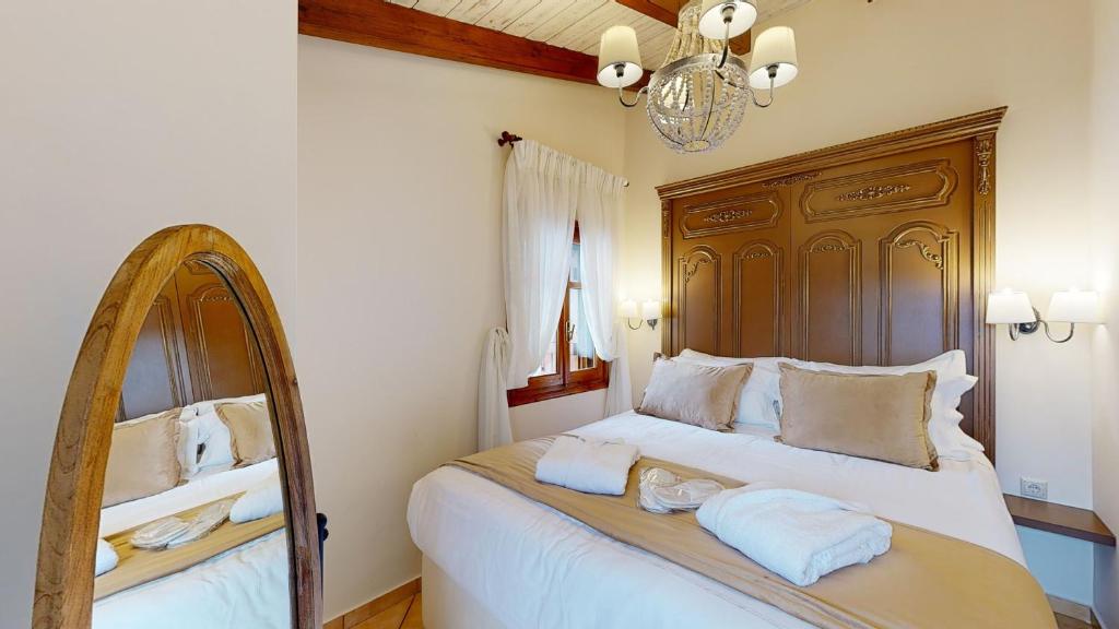 Postel nebo postele na pokoji v ubytování Parnassos Chalets