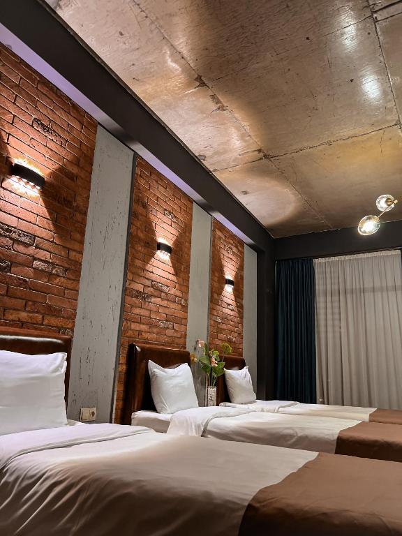 Postel nebo postele na pokoji v ubytování TM Apart Hotel