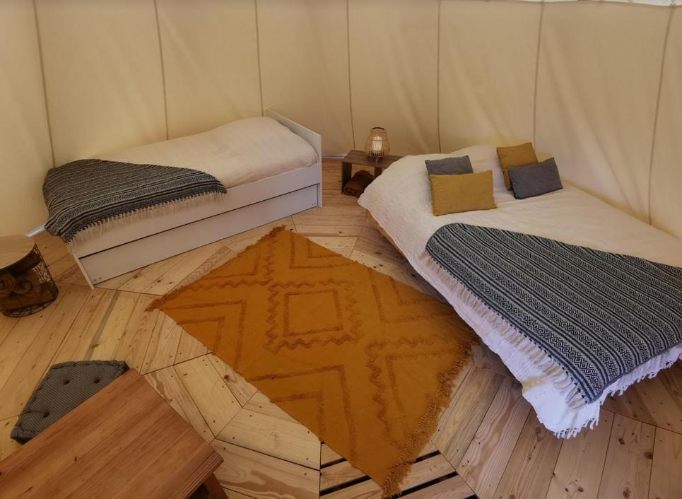 Postel nebo postele na pokoji v ubytování La Parenthèse Meslandaise