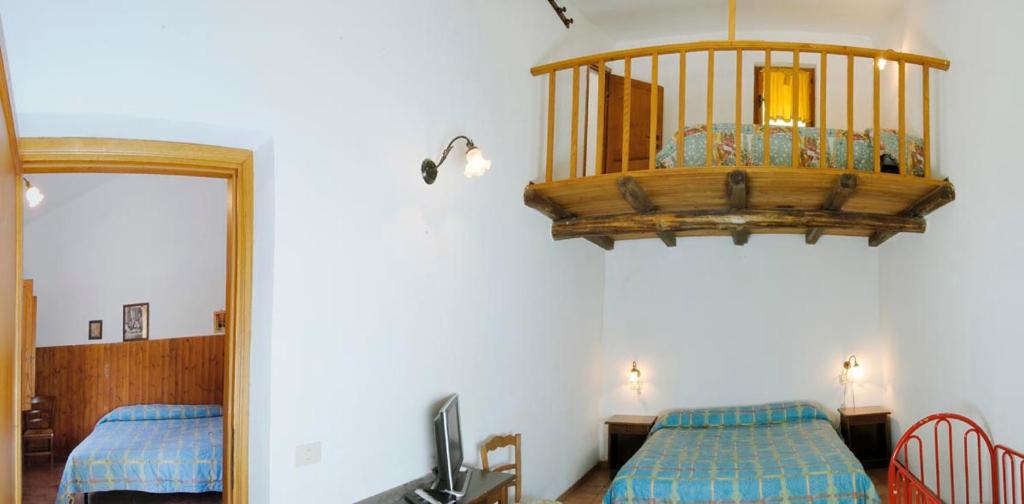 Postel nebo postele na pokoji v ubytování Agriturismo La Ferrera