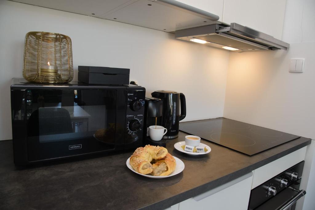 Maya's Apartmentsにあるキッチンまたは簡易キッチン