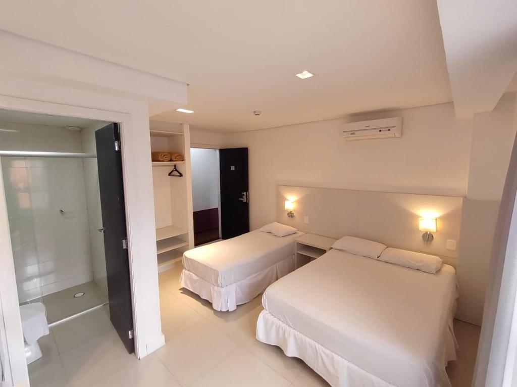 Postel nebo postele na pokoji v ubytování Hotel São Mateus