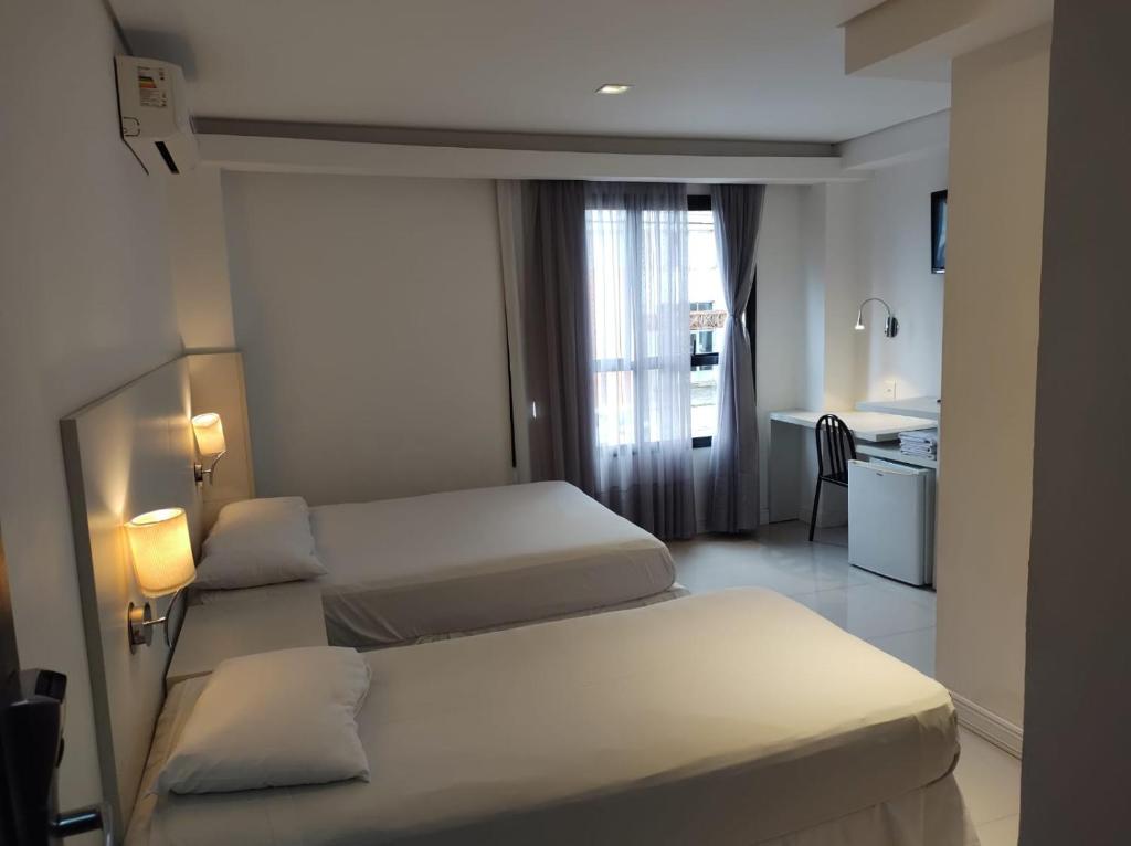 Postel nebo postele na pokoji v ubytování Hotel São Mateus