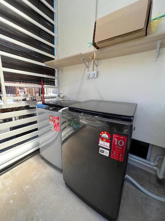 a kitchen with a small refrigerator and a counter at myROOM @ Mandalay Georgetown, Off Jln Burma, Gurney Drive in George Town