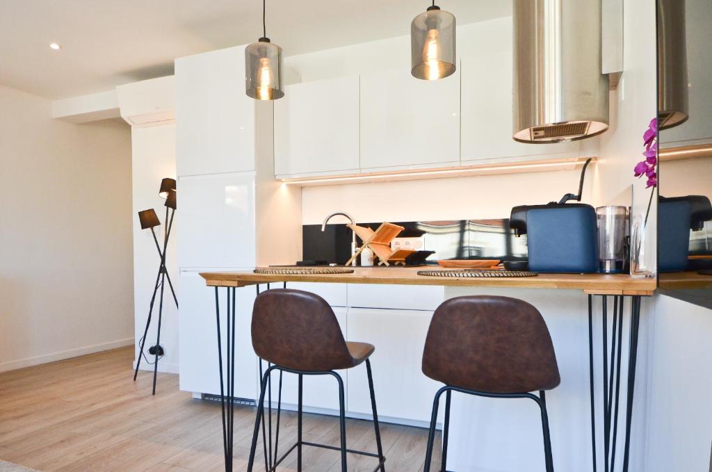 Kuchyňa alebo kuchynka v ubytovaní Le Flore - Appartement neuf - Cannes Center
