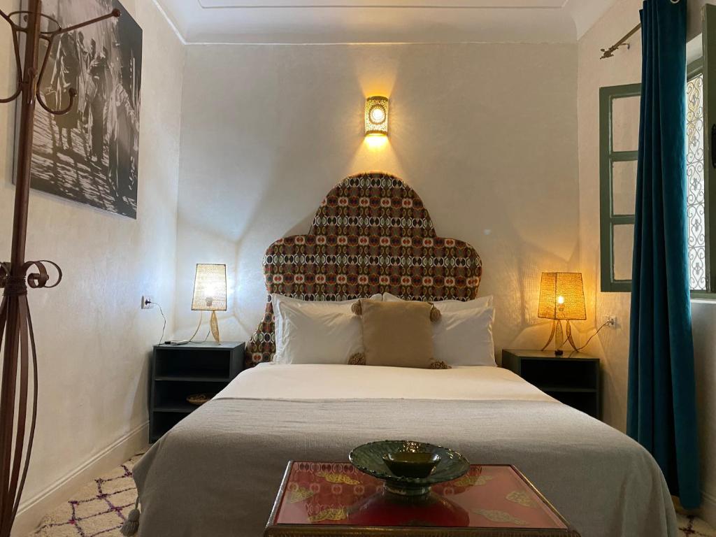Tempat tidur dalam kamar di Riad Green Vines