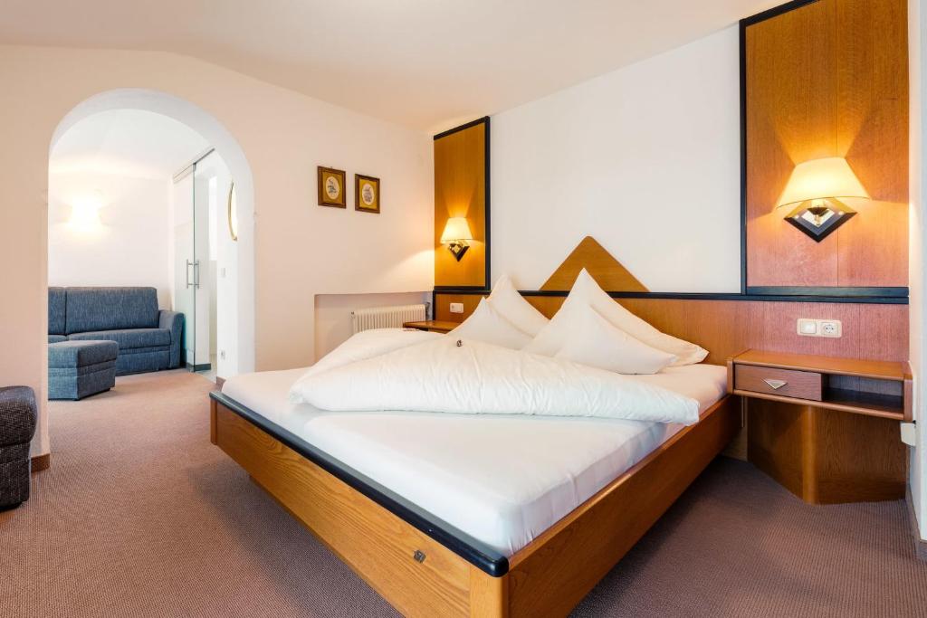 Postel nebo postele na pokoji v ubytování Hotel Regina