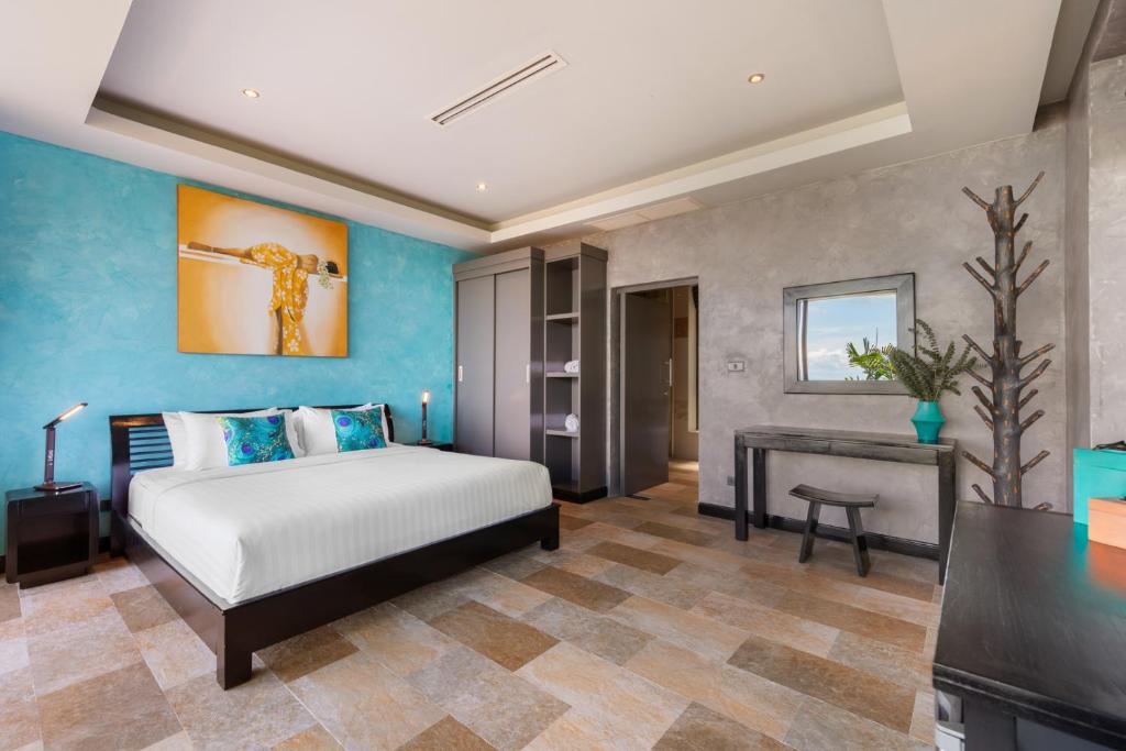 Postel nebo postele na pokoji v ubytování Villa Tiga - Cliffside Seaview Oasis