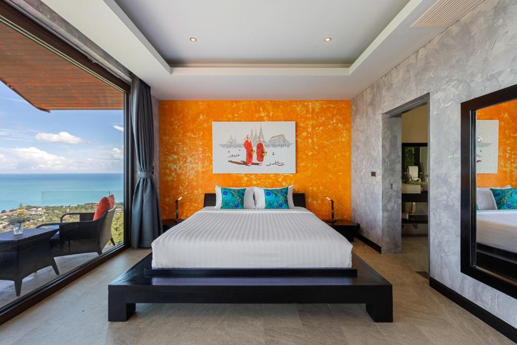 Postel nebo postele na pokoji v ubytování Villa Tiga - Cliffside Seaview Oasis