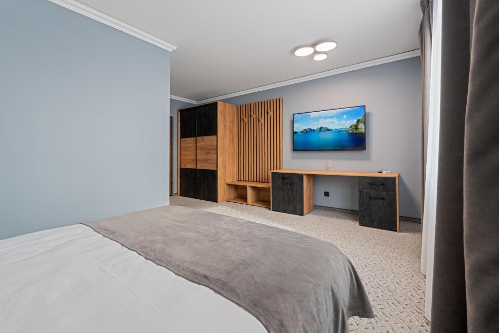 Postel nebo postele na pokoji v ubytování Fit Residence