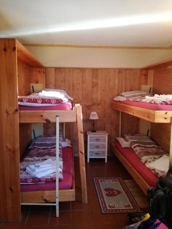 Posteľ alebo postele v izbe v ubytovaní Rifugio Vieux Crest
