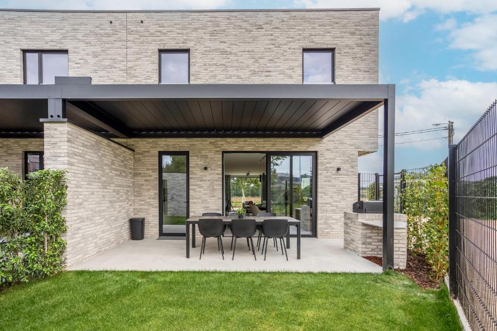 Zahrada ubytování NIEUW - De Grenspaal WEST 6P 5 min Maastricht - Sauna - Laadpaal