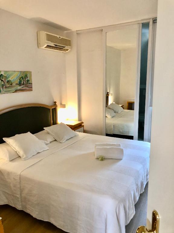 Postel nebo postele na pokoji v ubytování Hotel Pinocchio