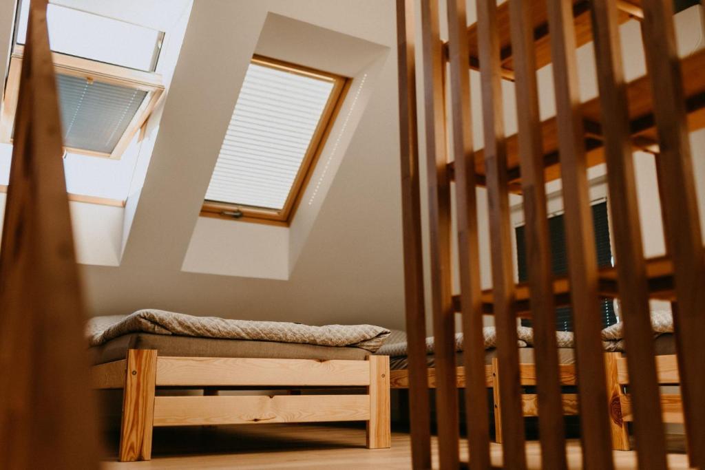 Posteľ alebo postele v izbe v ubytovaní Domki pod Kamionna