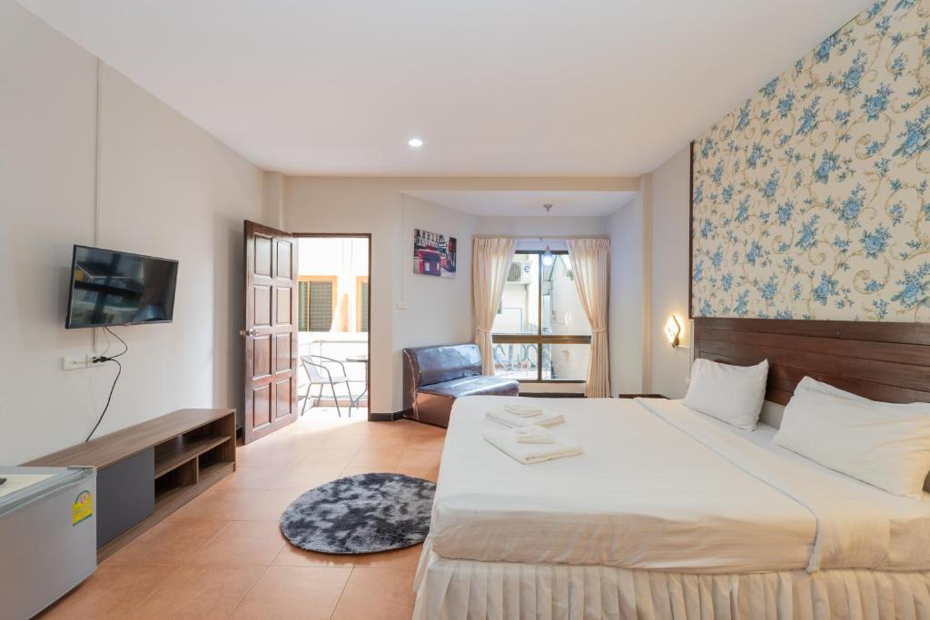 Postel nebo postele na pokoji v ubytování Amarin Hotel Patong