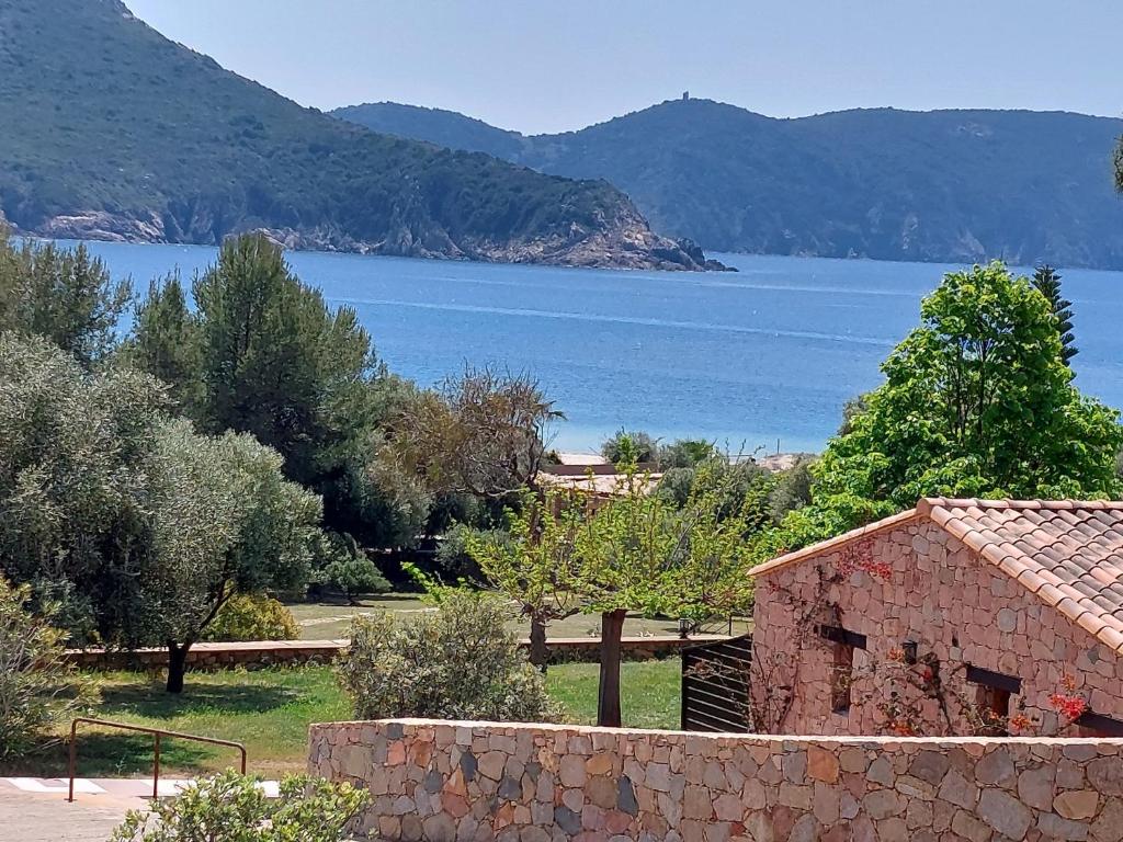 a view of a large body of water with a house at U Casinu in Piana
