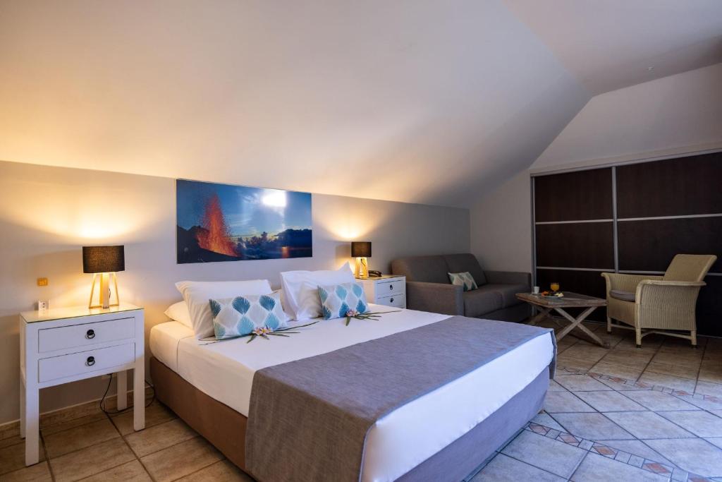 Postel nebo postele na pokoji v ubytování Hôtel Les Créoles