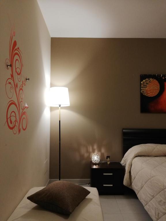 Posteľ alebo postele v izbe v ubytovaní B&B Li Figuli