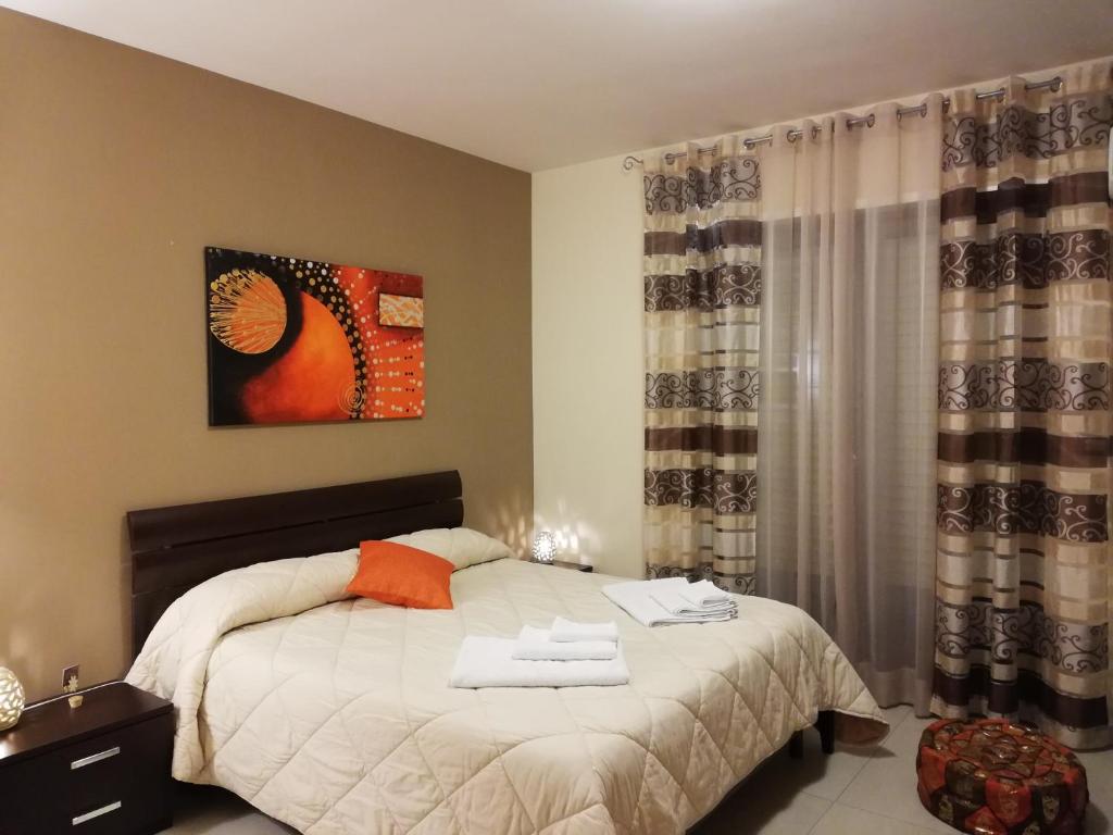 Posteľ alebo postele v izbe v ubytovaní B&B Li Figuli