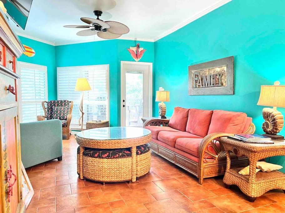 a living room with a couch and a table at Riverfront condo downtown newbraunfels in New Braunfels