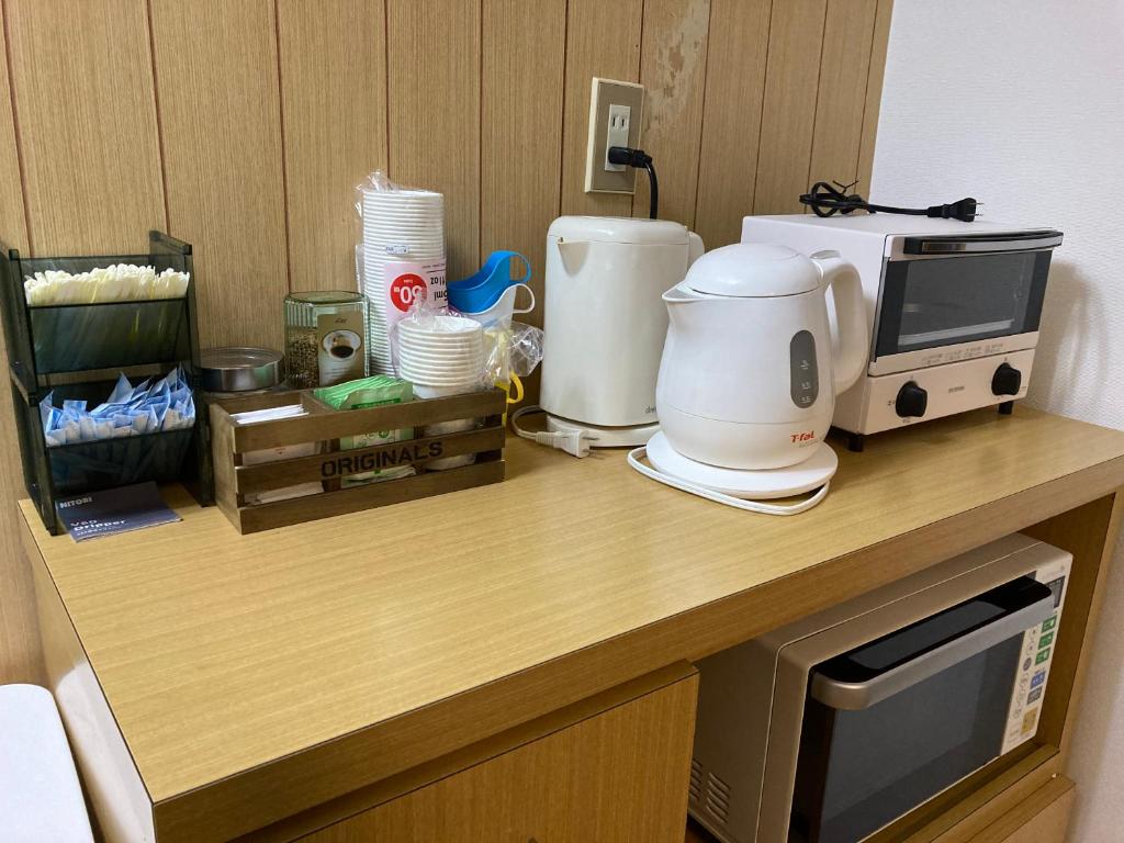 Kuchyň nebo kuchyňský kout v ubytování わがらん家 -えんつなぎ-