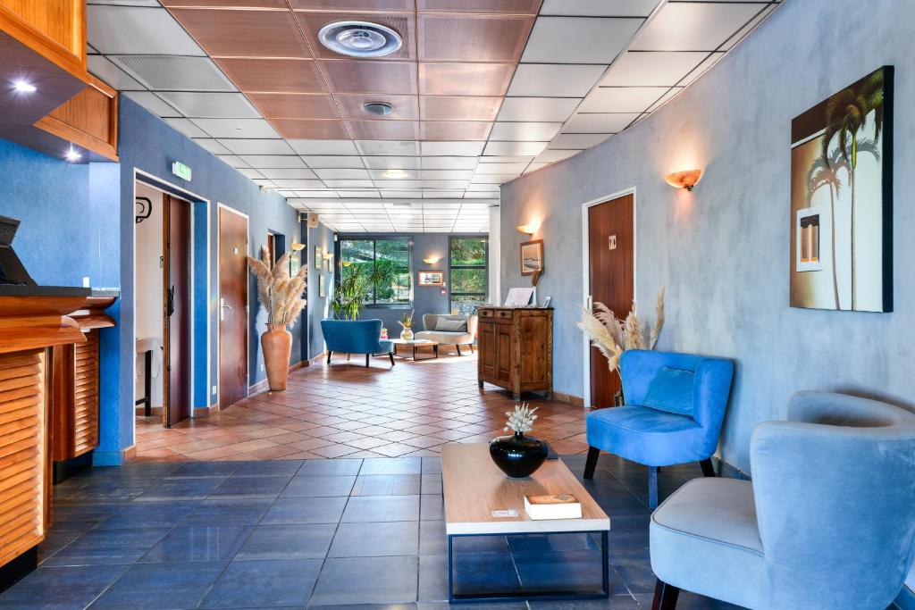 Posezení v ubytování Hotel Le Pavillon Bleu
