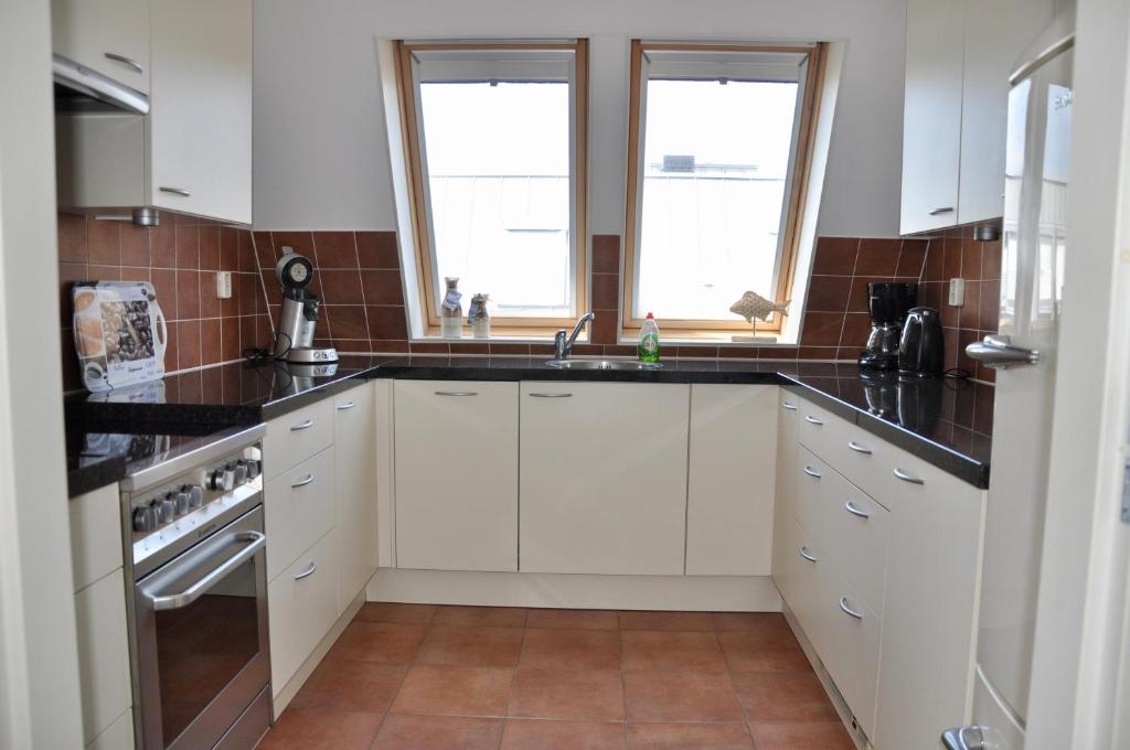Kuchyň nebo kuchyňský kout v ubytování Duinerei Penthouse B302