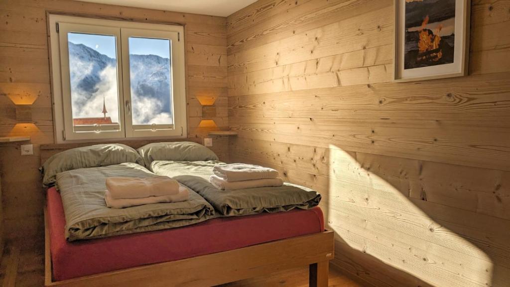 Una cama o camas en una habitación de Imhof Alpine B&B Apartments
