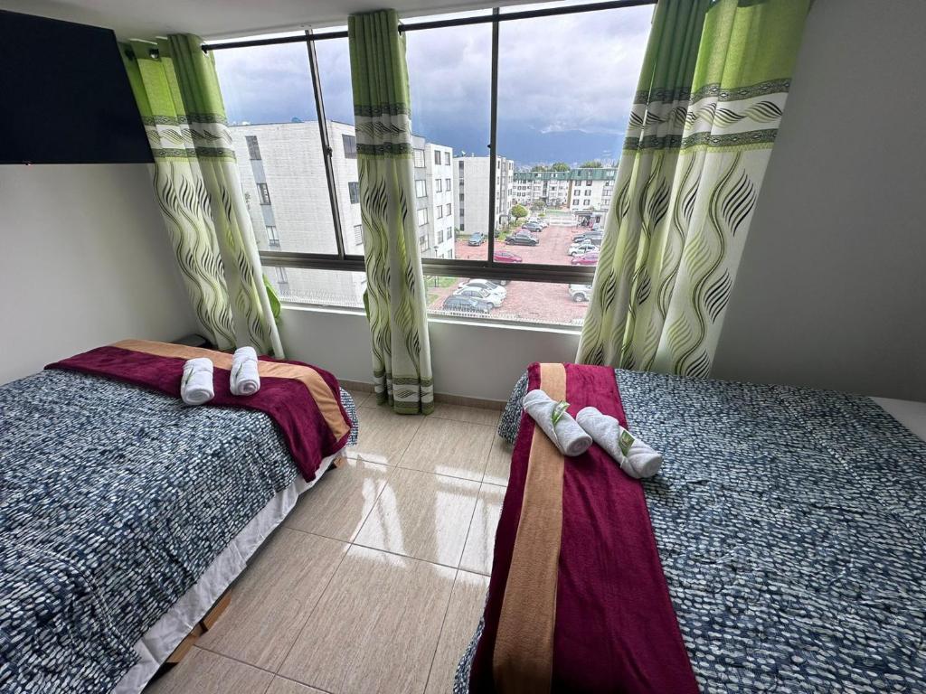 Postel nebo postele na pokoji v ubytování HOSPEDAJE SARY HOUSE