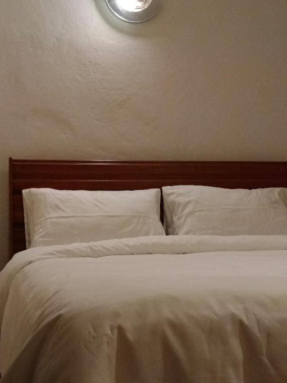 Postel nebo postele na pokoji v ubytování Tiki Bar-KanTiang Guesthouse