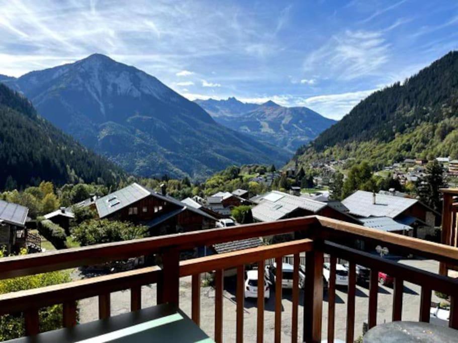 a view of a valley from a balcony with mountains at T3 Champagny-en-Vanoise avec terrasse plein sud in Champagny-en-Vanoise