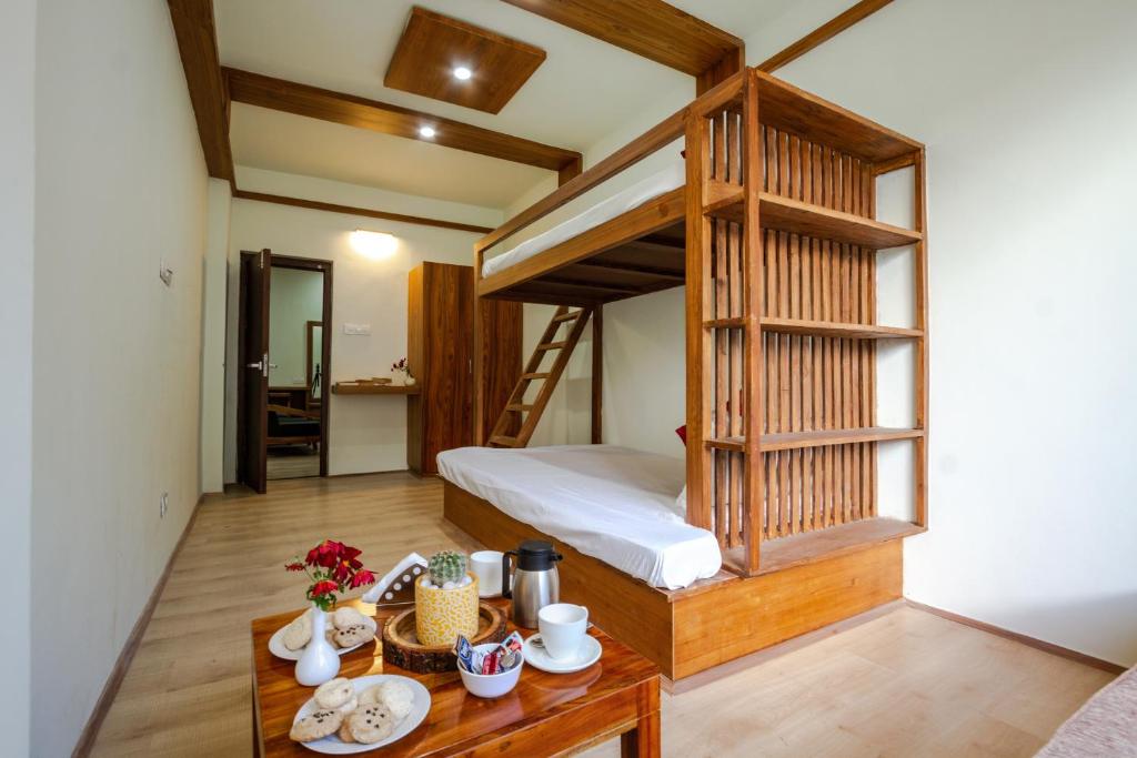 Postel nebo postele na pokoji v ubytování Tripli Hotels Drilbu Manali