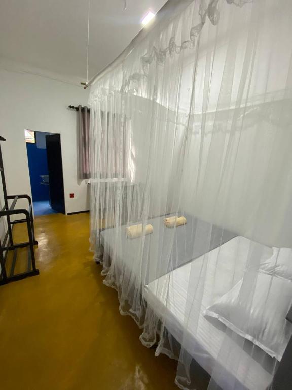 Postel nebo postele na pokoji v ubytování Pearl Villa Rooms and Hostel