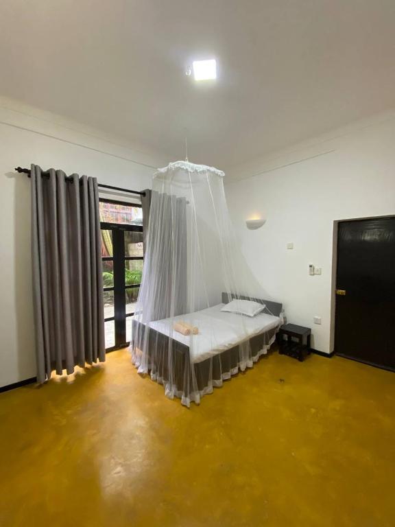 Postel nebo postele na pokoji v ubytování Pearl Villa Rooms and Hostel