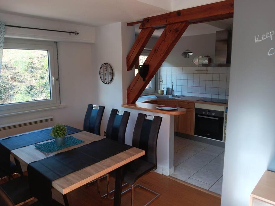 a kitchen and dining room with a table and chairs at Superbe gite au centre de Kaysersberg avec 3 chambres in Kaysersberg