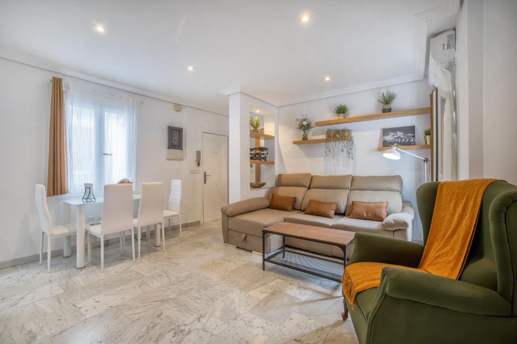 a living room with a couch and a table at Zafiro Apartment&Parking in the historical centre in Córdoba