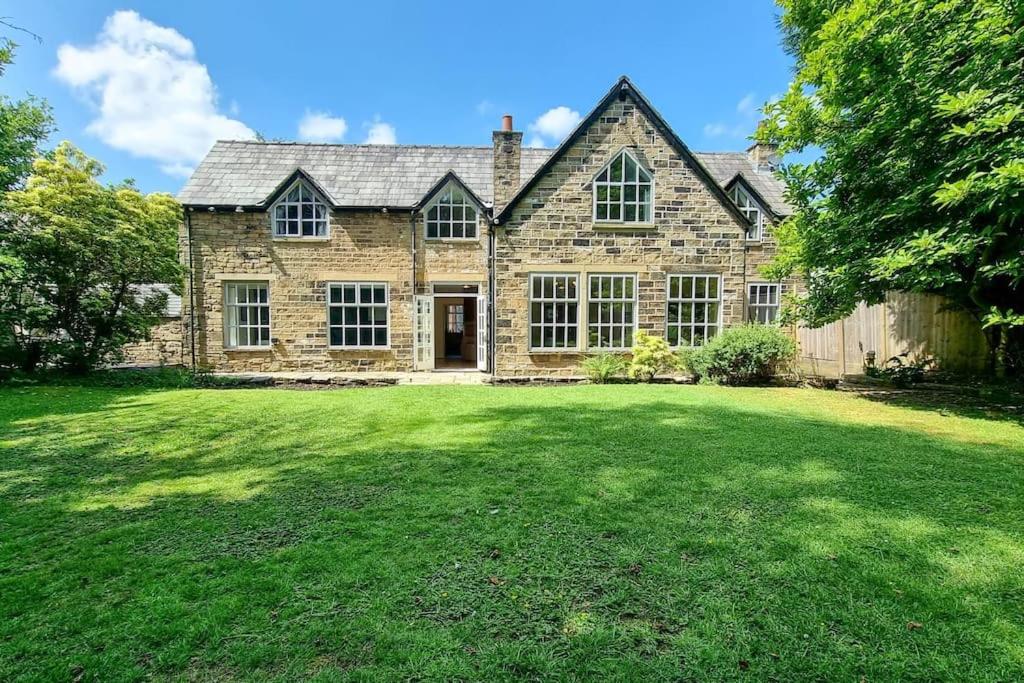an old stone house with a large yard at Spacious stone cottage w/ extensive private garden in Bolton