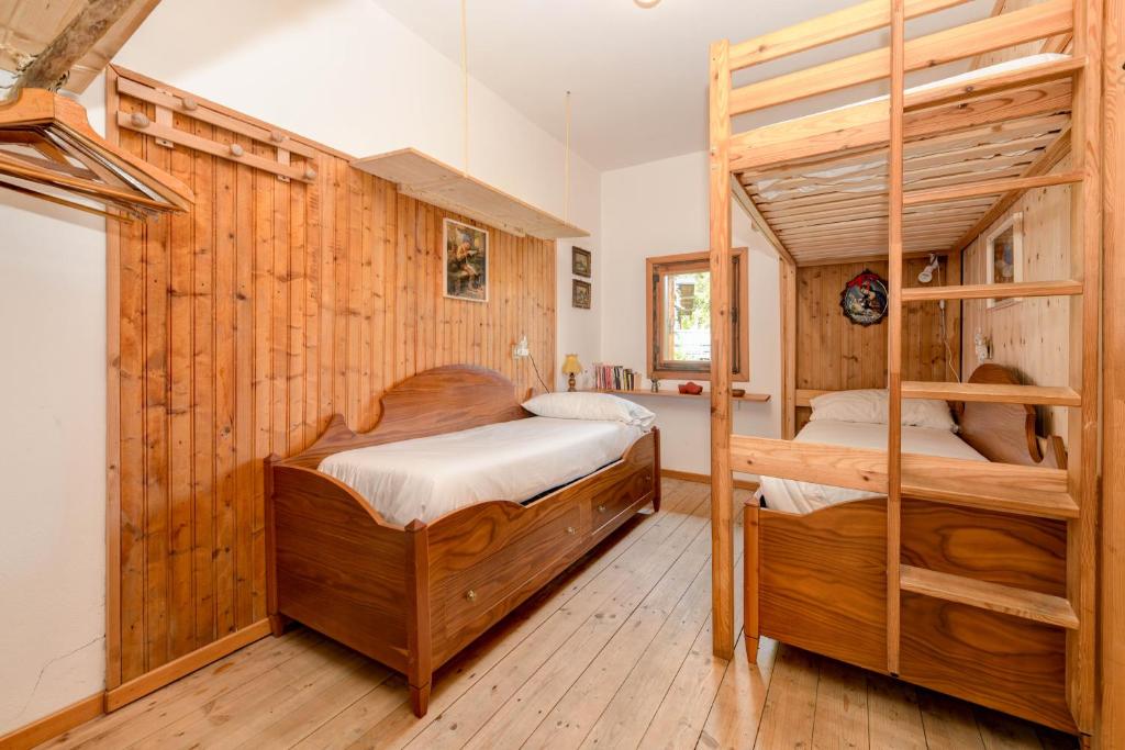Postel nebo postele na pokoji v ubytování Chalet "Baita Cavacca"