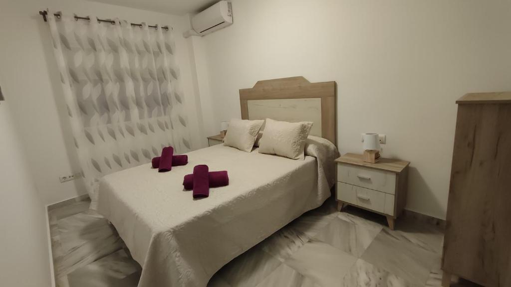 Posteľ alebo postele v izbe v ubytovaní Apartamentos Séneca junto al Centro