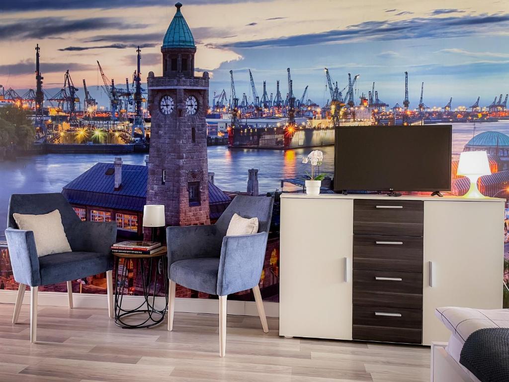 a room with a view of a harbor with a clock tower wallpaper at Villa Blue Arany Apartman in Szekszárd