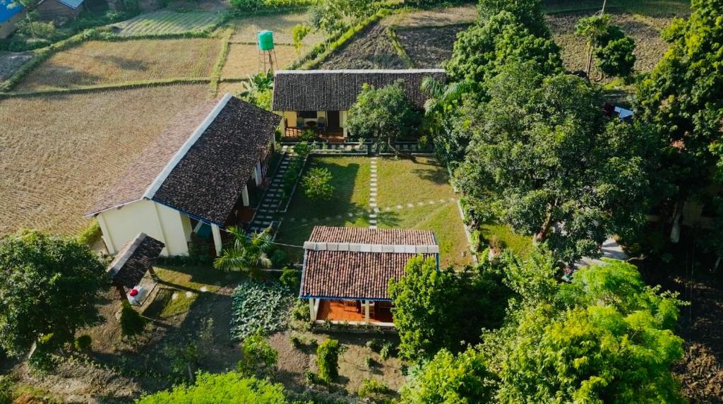 an overhead view of a house with a yard at Bardia Eco Friendly Homestay in Bhurkīā