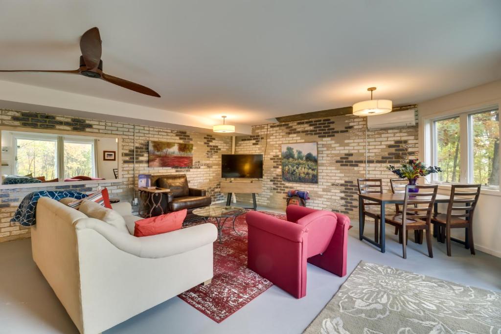 a living room with two couches and a dining room at Renovated Studio on 5 Acres - Near Vineyards! in Crozet