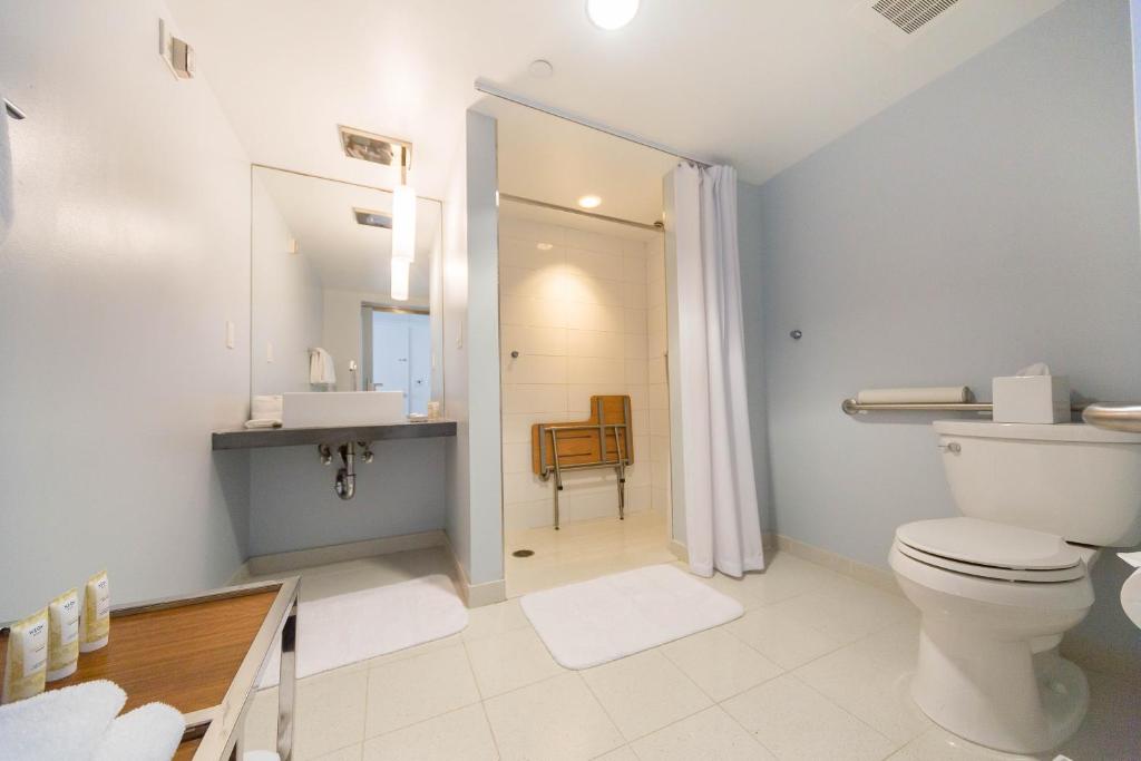 a bathroom with a toilet and a sink at Tower 23 Hotel in San Diego
